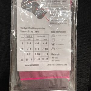 Plantar fasciitis compression socks 2 pair in the bag black and pink.